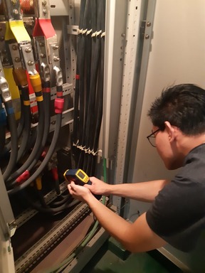 Technician servicing an electrical control installation