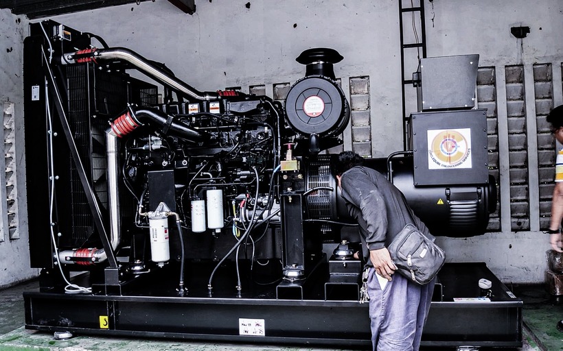 Circleqube technician working on an industrial generator system